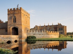 Broughton Castle is a medieval moated manor house in Oxfordshire whose interiors were used to represent Windsor Castle.