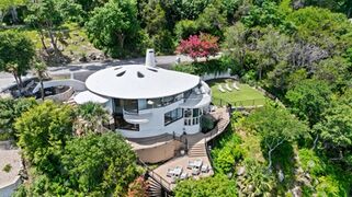 ”The Sand Dollar House” is a landmark in Lakeway, TX built in 1979 by FLW protege architect John Covert Watson