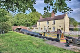 The stone-built lock keeper’s cottage at Tixall Lock on the Staffs & Worcs Canal.