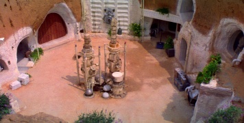 The Lars Homestead on planet Tatooine where Luke Skywalker grew up. The surface level dome house was a set constructed for the movie at Nefta, Tunisia while the courtyard pit was a real hotel, the Hôtel Sidi Driss in Tunisia, 250 miles away in Malmaison.