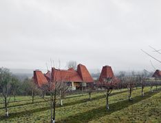 Caring Wood in Kent - a new build home referencing the hop-drying towers of the local oasts by Macdonald Wright Architects and winner of the 2017 RIBA House of the Year Award