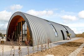 A former light aircraft hangar in rural Essex transformed into a 5 bed home that featured on C4's 'Grand Designs'