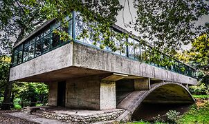 ‘Casa Del Puente’ 1942, by the Argentinian architect Amancio Williams (1913-1989) was a house for his father. This small concrete building spans a creek on the father's property in Mar del Plata.