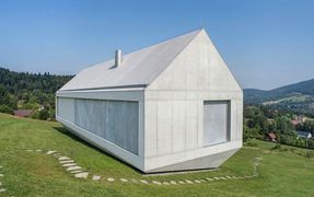 This futuristic concrete residence located in Brenna, Poland, was designed by KWK Promes.