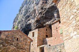 Troglodyte houses at Peyres, Viala-Du-Tarn in the Aveyron region of southern France. This ancient village takes its name from the rock (pierre) against which it was built.